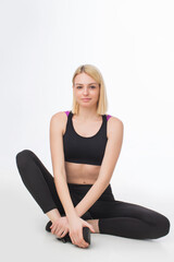 Young blonde woman in sportswear