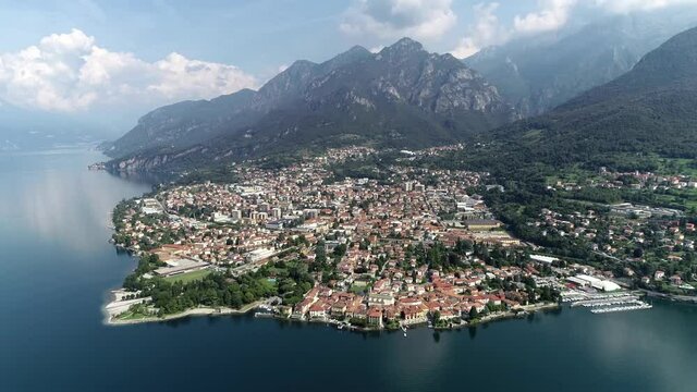Aerial view of Mandello del Lario is an Italian town and comune in the province of Lecco in Lombardy on Lake Como since 1921 it has been home to a famous motorcycle manufacturer 4k high resolution