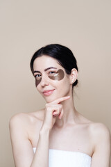 Eye patch, Beautiful Woman With Natural skin And Green Hydro Gel Eye Patches under her eyes. Caucasian woman use patches after shower, skin care