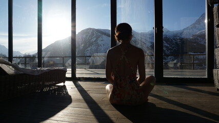 meditation overlooking the sunlit mountains