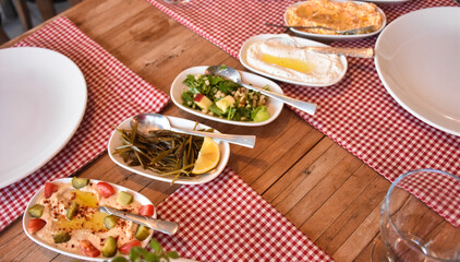 Aegean appetizers in small plates on the table. Traditional Turkish and Greek dinner meze table. Turkish Cuisine Cold Appetizers appetizers with olive oil