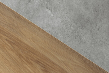 Stylish texture of old gray concrete glossy wall and wooden surface for background. Copy space.