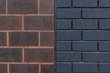 Dark orange and black brick wall texture background close-up.