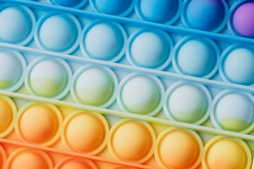 Close up of Pop toy silicone background. Rainbow Hues colors.