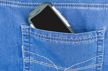 Cellular telephone in blue jeans pocket