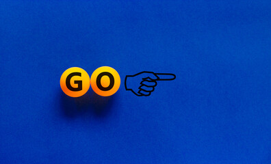 Time to go symbol. Conceptual image of motivation. Orange table tennis balls with the word 'go',...