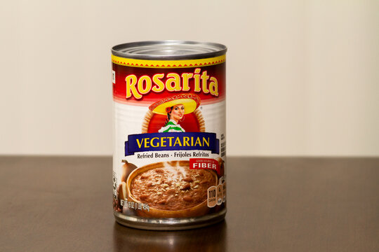 Victorville, CA, USA – May 26, 2021: A 16 ounce can of Rosaria Vegetarian Refried Beans on a table.