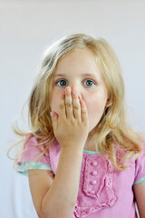 girl covering her mouth with her hand, child, emotions