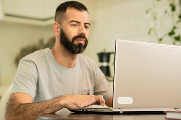 disabled person using laptop at home.