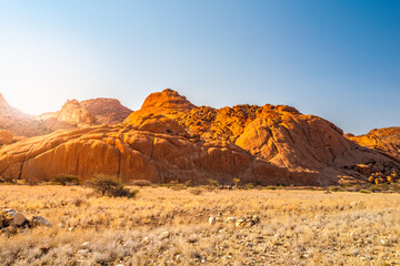 Pontok Mountains near Spitzkoppe. Red vivid granite rock formation in Namib Desert at sunset time, Namibia, Africa
