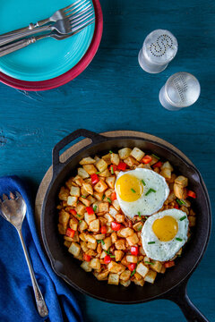 Potato hash and eggs in cast iron skillet