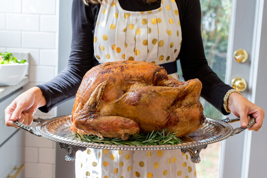 Woman with Thanksgiving turkey 