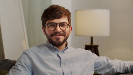 Fototapeta premium The white European looks at the camera and shrugs.