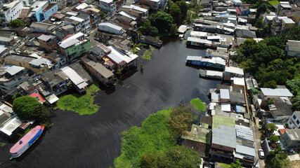 Aerial view of houses submerged in water during the rise of Negro River due to heavy rains and the La Nina phenomenon in Manaus, Amazonas state, Brazil.