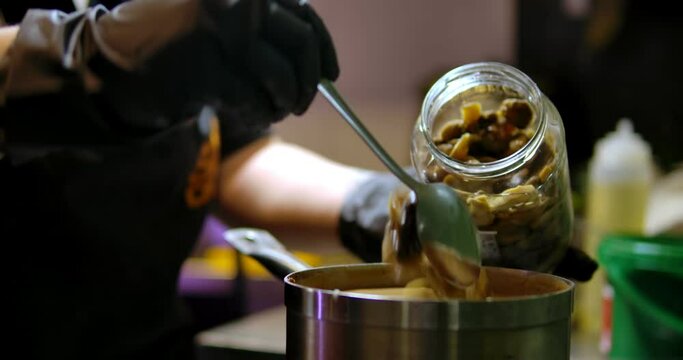 Cooking delicious soup with mushrooms 