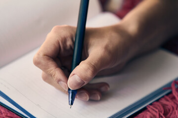 Long-term planning, writes in a notebook