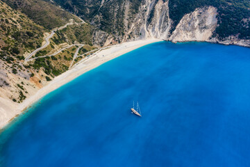 Aerial view of Luxury Sail Yacht in Myrtos beach with blue bay on Kefalonia Island, Greece