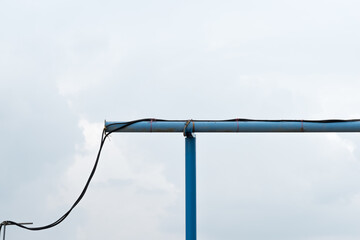 A blue water pipe on a construction site 