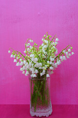 Bouquet of fragrant stems of white Lily of the valley flower bells