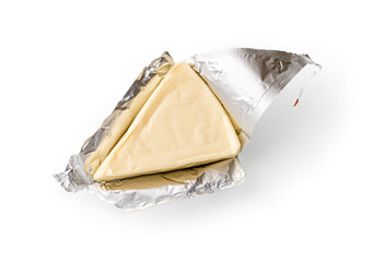 Foil wrapped processed creame cheese slice isolated on a white background. Small triangular piece...