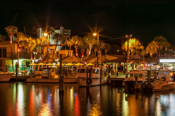 Waterfront businesses at night along the Halifax River, Daytona Beach, Florida, USA