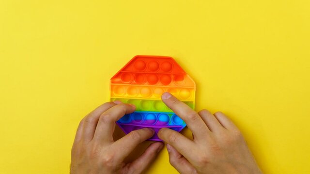 Toy pop it. Rainbow color. Antistress toy for children and adult. Top view