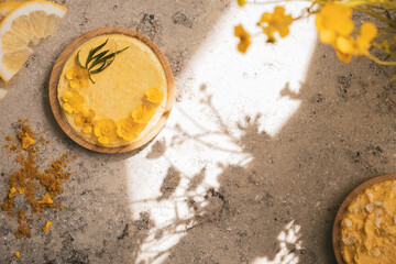 lemon cream, lemon slices and yellow flowers, space to write