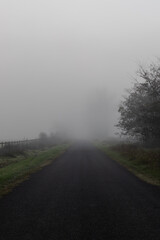 Thick fog on the road in the mountain.