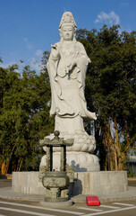Fototapeta na wymiar Statue of Kwan Yin (Guan Yin), Goddess of Mercy, Puh Toh Tze (Poh Toh Tse, Pu Tuo Si) Buddhist temple, Kota Kinabalu, Sabah (Borneo), Malaysia