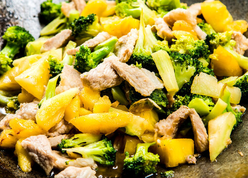 Frying Broccoli With Pineapple In Pan, In Door Chiangmai Thailand