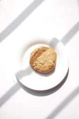 whole meal cookies on plate on white 