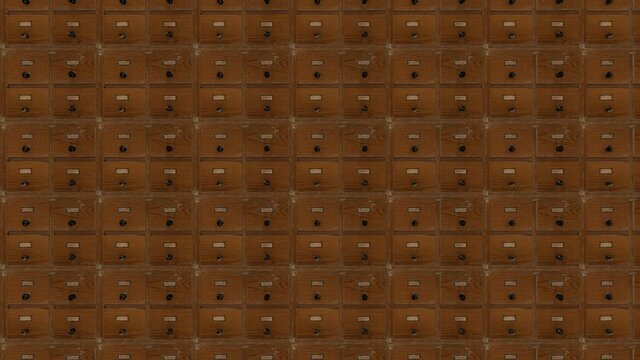 The camera zooms slowly over endless rows of old catalog boxes.