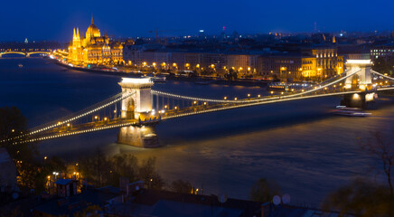 Fototapeta na wymiar Night view on Patliament and Chain Bridge in hungarian city Budapest outdoors.