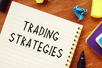 Financial concept about TRADING STRATEGIES question marks with phrase on the sheet.