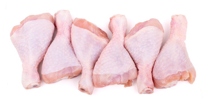 group of raw chicken drumsticks isolated on white background