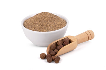 Closeup black pepper seeds or peppercorns in white bowl and scoop isolated on white background
