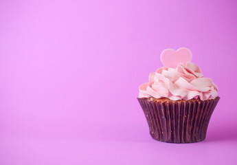Pink heart on top of cupcake