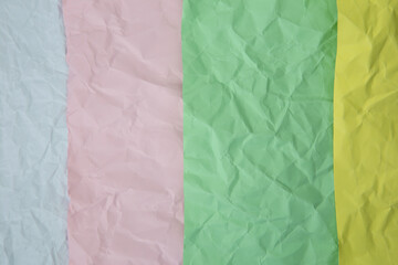 Wrinkled pastel paper colors Top view photo for summer background with text and copy space.