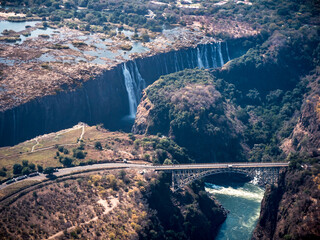 Victoria Falls Waterfall with Bridge over the Zambezi River connecting Zimbabwe and Zambia, Africa