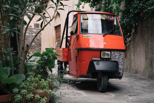 Castiglione d'Orcia, Italy - August 18 2020: Piaggio Ape 50, an Italian three-wheeled light commercial vehicle based on the Vespa Scooter.