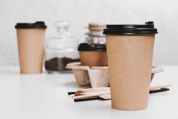 Paper eco disposable brown cup coffee latte or or any other drink on a table