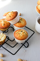 Lemon muffins sprinkled with chopped pistachios.