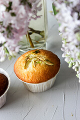 Lemon muffins sprinkled with chopped pistachios.
