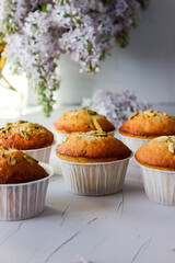 Lemon muffins sprinkled with chopped pistachios.