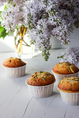 Lemon muffins sprinkled with chopped pistachios.
