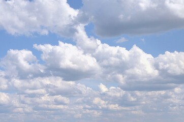 Powerful, spring, cumulus clouds against the blue sky

