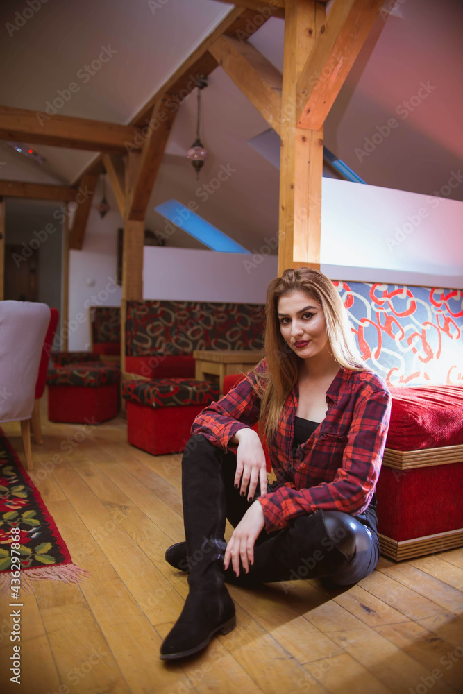 Canvas Prints Caucasian young female with a plaid red t-shirt at home