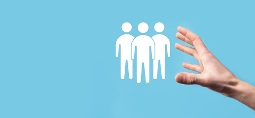 Obraz premium Businessman hold teamwork icon. Building a strong team. people icon. Human resources and management concept. social networking, assessment center concept, personal audit or CRM concept.
