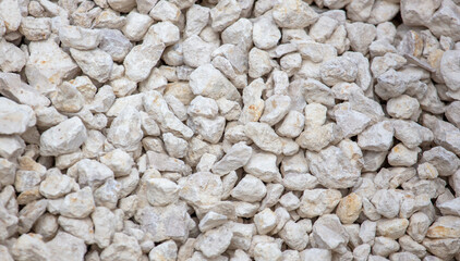 White stone gravel as background.