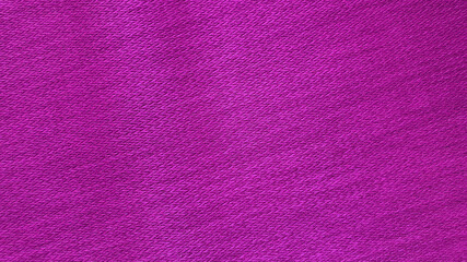 photography of pink woolen fabric texture background. bright violet clothing background. pink texture with blank space for design.